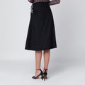 Navy blue draped skirt with brooch