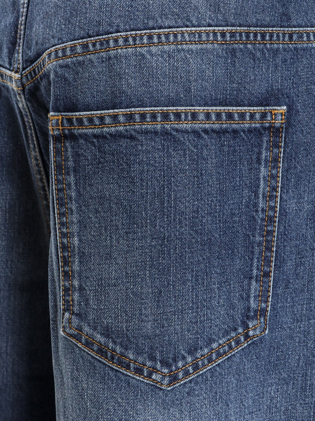 Twisted stone-washed denim jeans