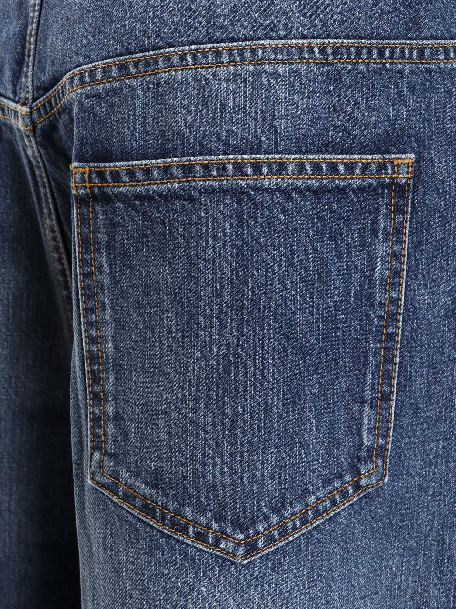 Twisted stone-washed denim jeans