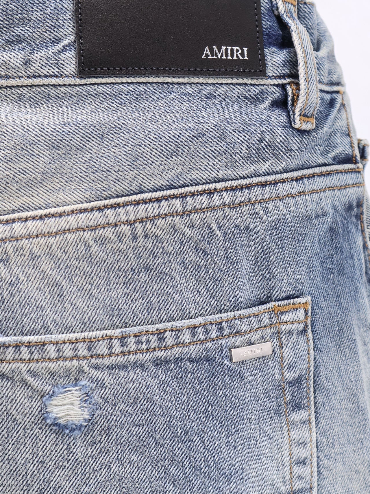 Destroyed effect jeans