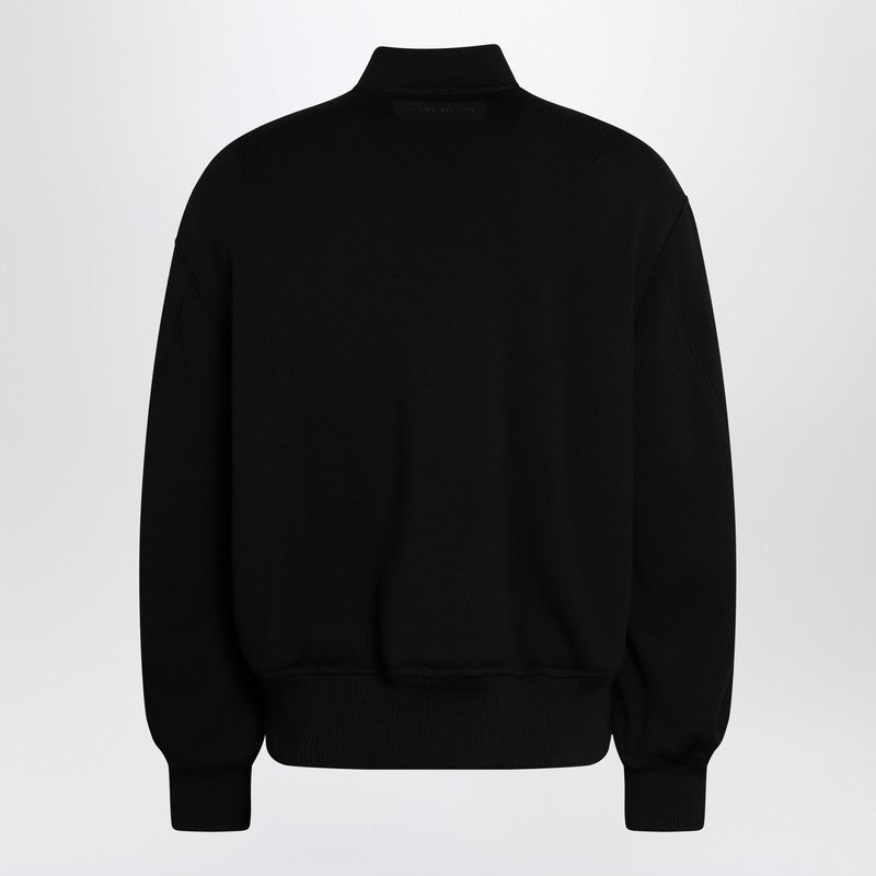 Black leather bomber jacket with wool sleeves