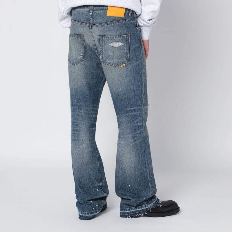 Faded indigo jeans with rips
