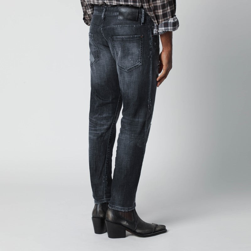 Slim black washed jeans with distressed details