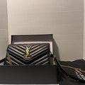 PreOwned Black and gold Saint Laurent Paris leather crossbody